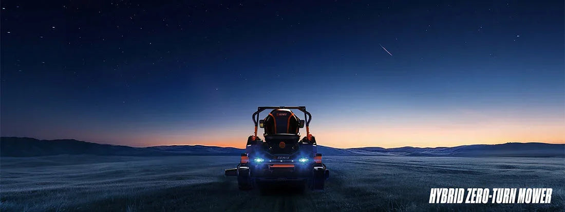 Hybrid zero-turn lawn mower at dusk on open field under starry sky with shooting star